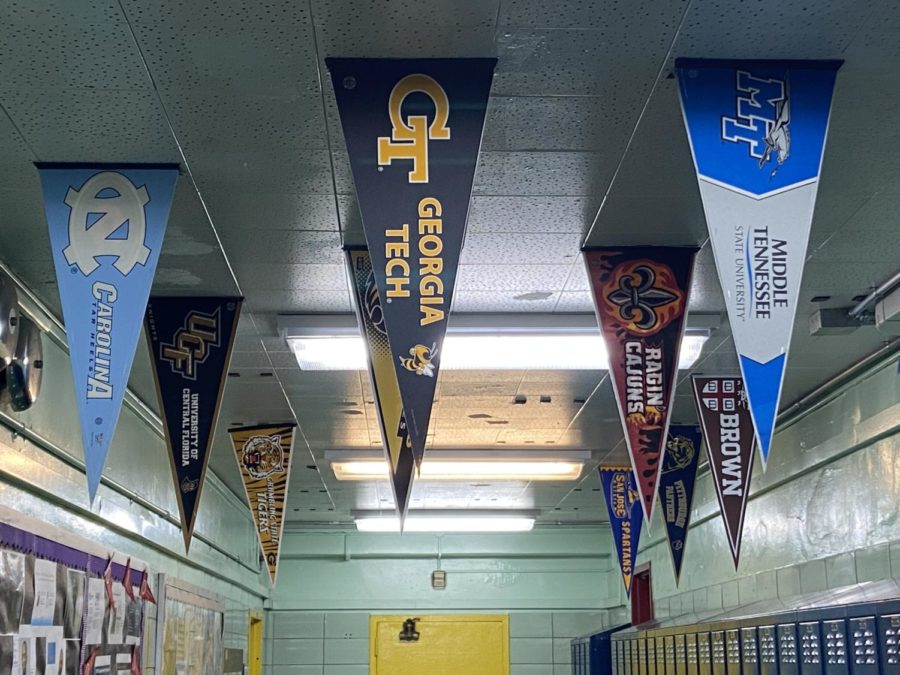 College banners in the second floor hallway at HS223 (Photo by Jason Garcia)
